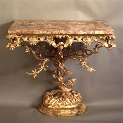 One of a pair of rococo Chippendale casual tables by English School